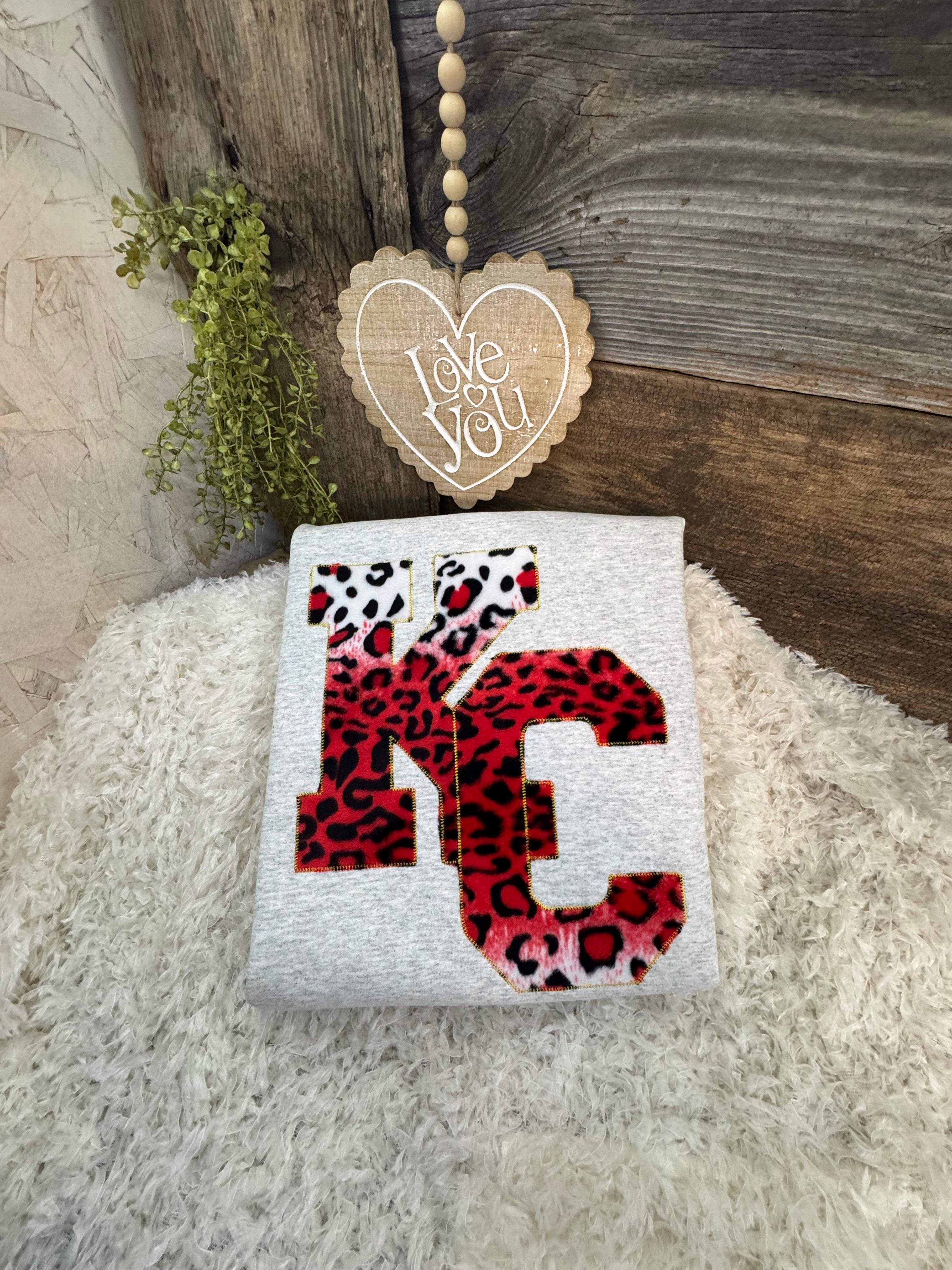 Interlocking KC applique